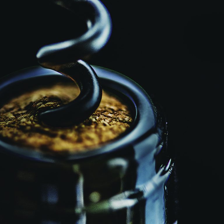 Uncorking a bottle of red wine