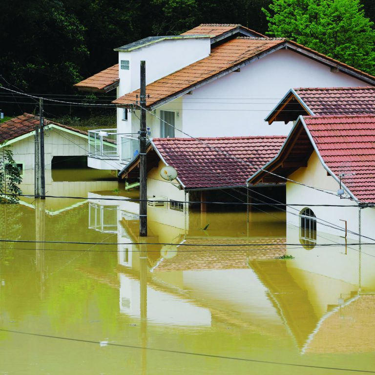 Houses,Are,Partly,Seen,During,A,Heavy,Flood,In,Rio
