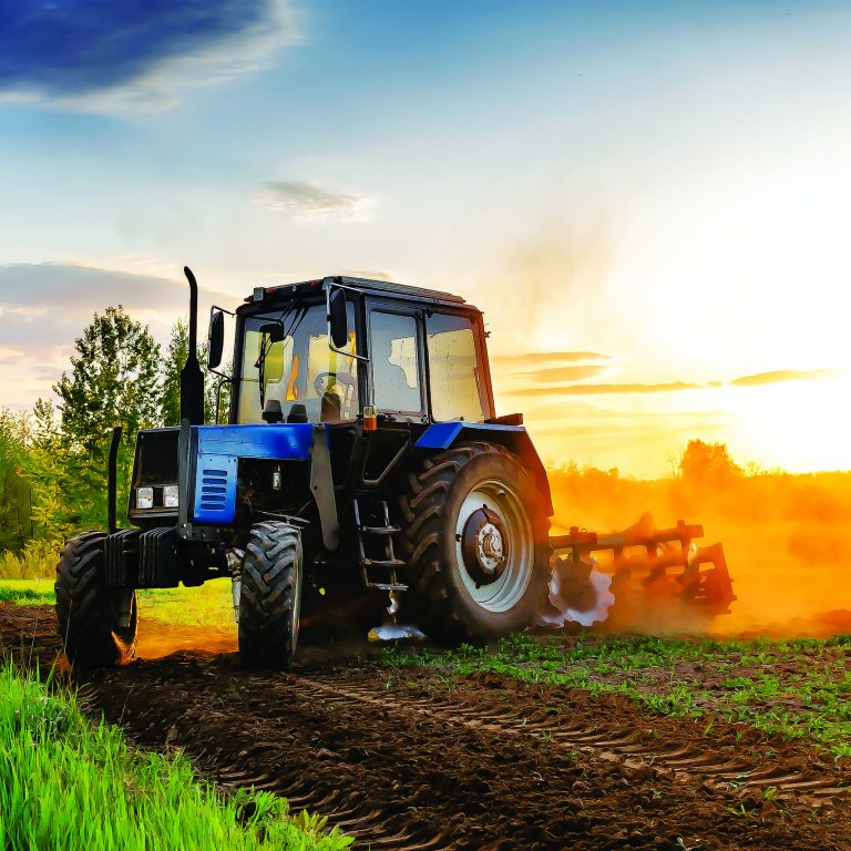 Modern,Blue,Tractor,Machinery,Plowing,Agricultural,Field,Meadow,At,Farm