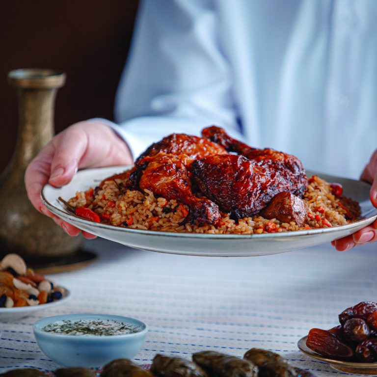 Kabsa close-up, rice and meat dish, saudi arabia national traditional food. Muslim family dinner, Ramadan, iftar. Arabian cuisine. Religious holiday, holy month.